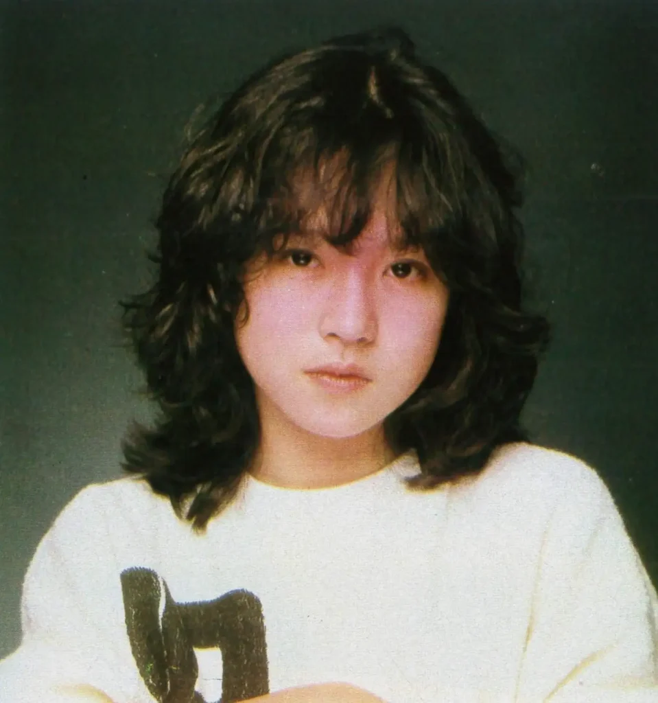 Romantic S-wave Japan curly hair style — soft flowing S-curl waves on Japanese woman