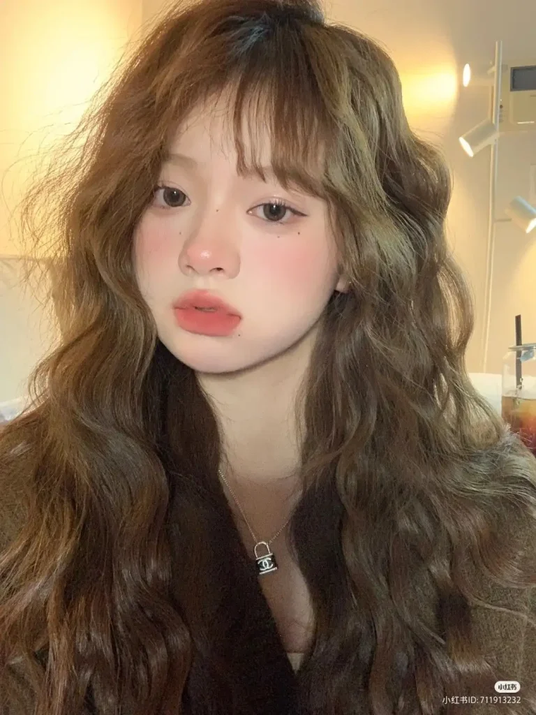 Japan curly hair in natural black color — glossy dark curls on Japanese woman