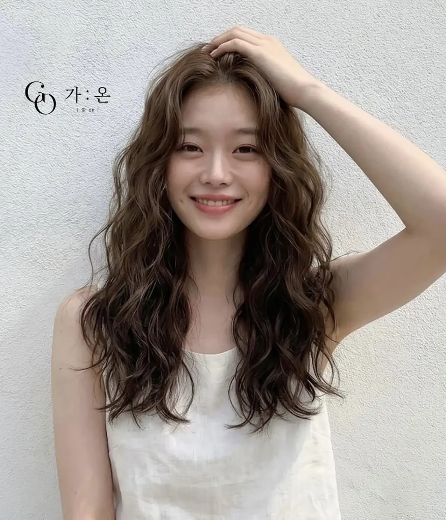 Japan curly hair after styling — soft touchable curls on Japanese woman with beautiful curl definition